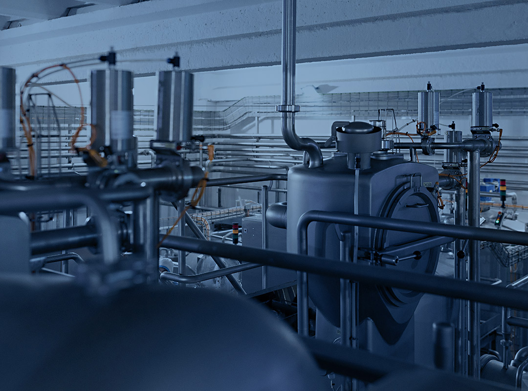 An intricate network of piping is shown in an industrial building - a process piping project of UPM Mechanical in Denver, Colorado